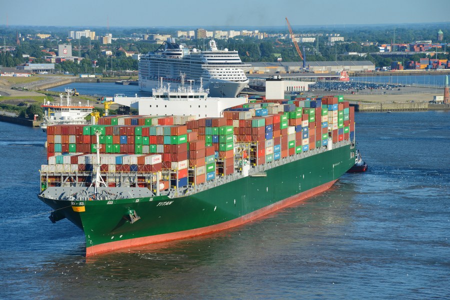 Hamburg, Germany - July 20, 2016: Container Ship TITAN (Length 369 meters, 14424 TEU) is leaving Hamburg Harbour