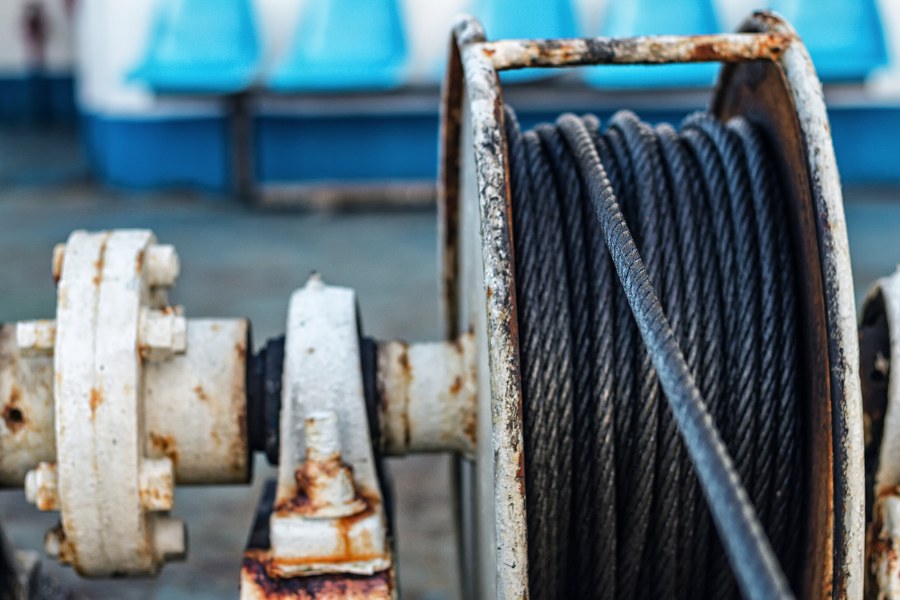 Iron wire on the winch on the deck of the ship
